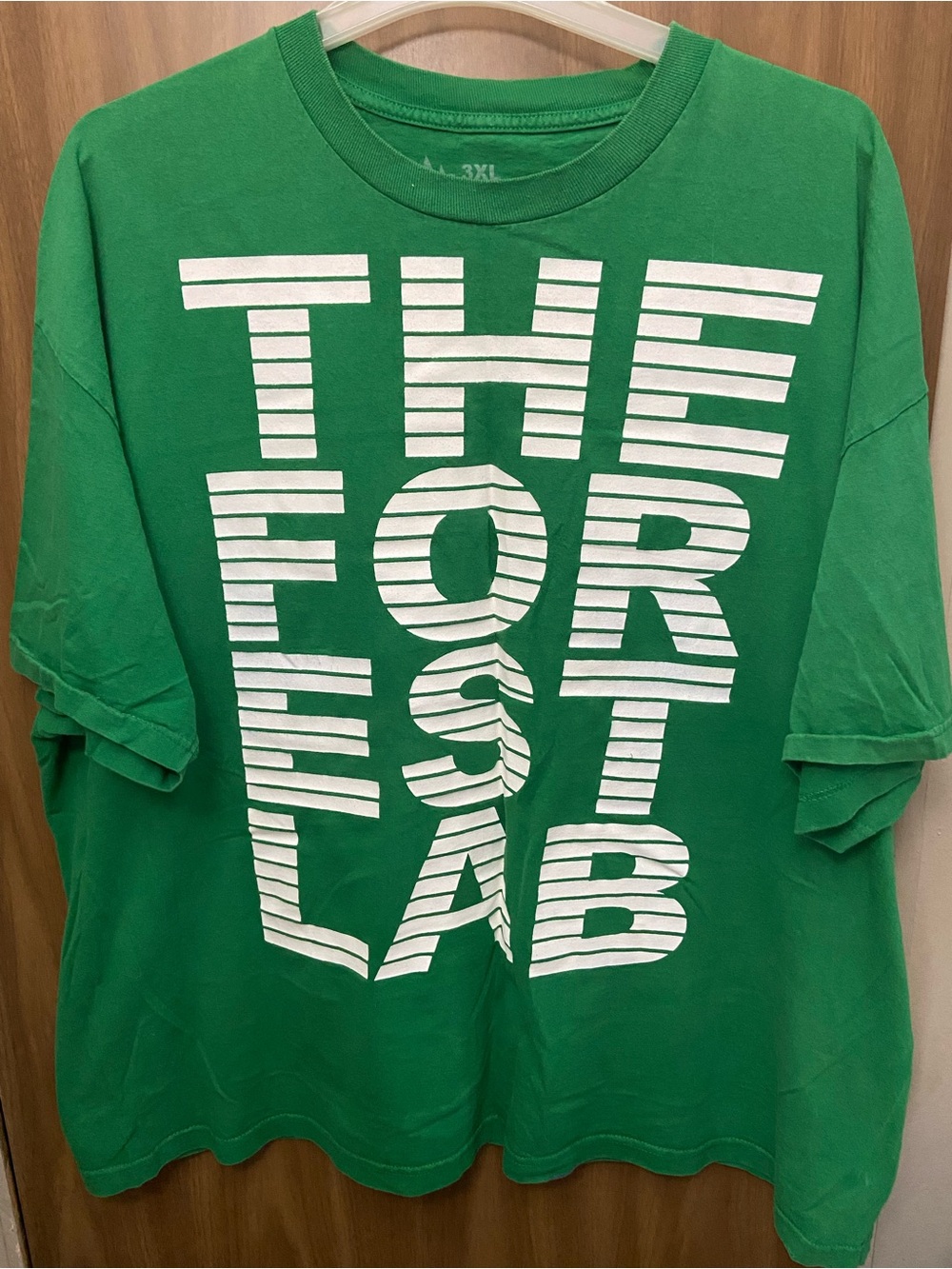 Green Short Sleeve Tee with White Graphic Text